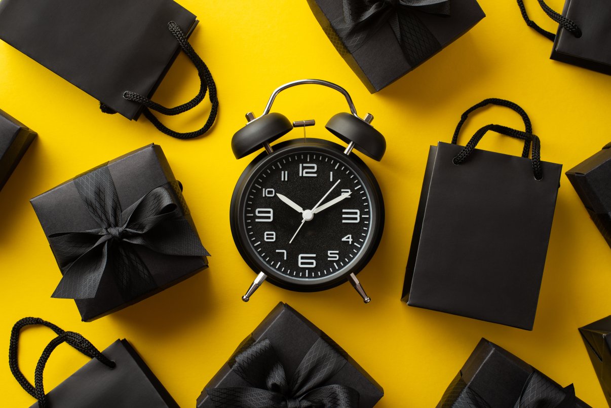 Black Friday black shopping bags and clock