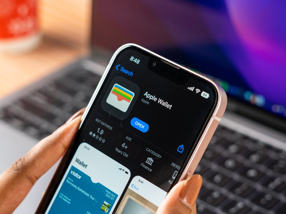 laptop and mobile phone displaying apple wallet 