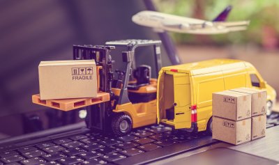 delivery trucks, parcels, airplane on computer